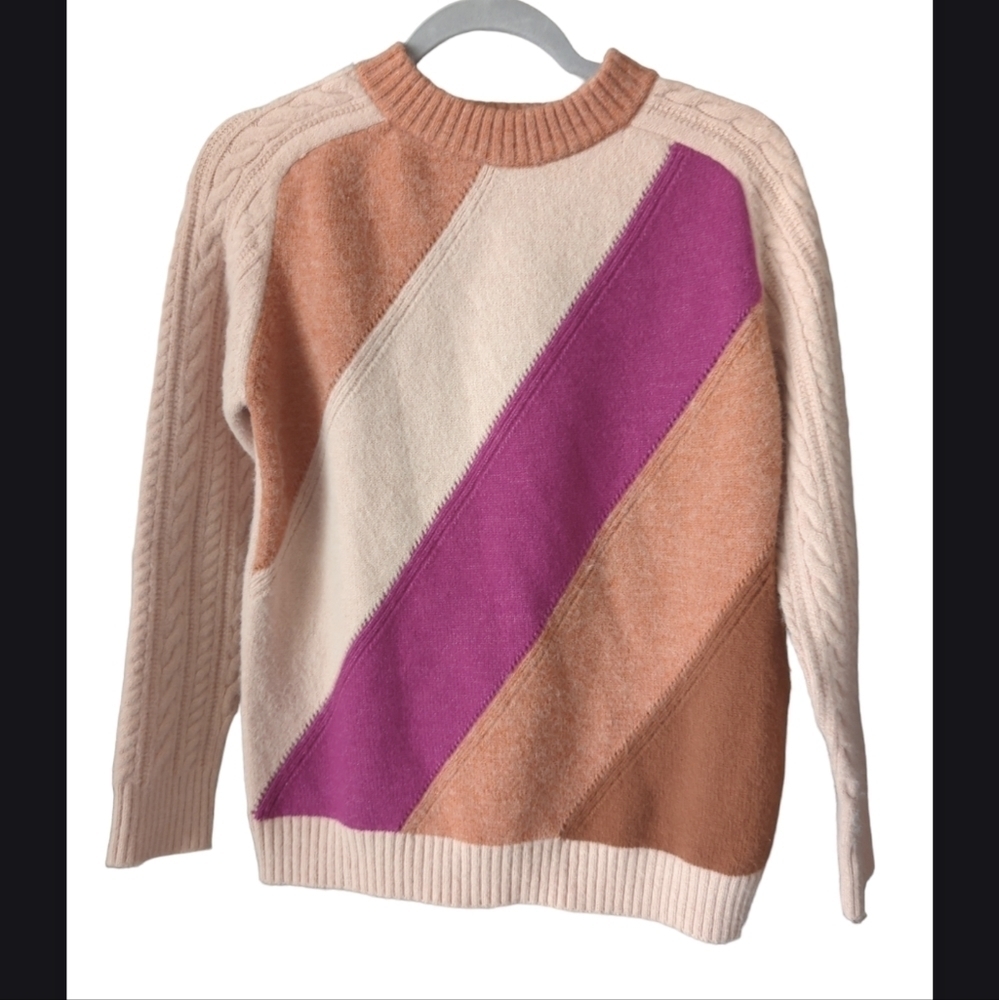 Cable knit sweater colors of pink.